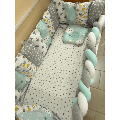 Schemă cu dimensiunile de siguranță ale barelor unui pătuț pentru bebeluși