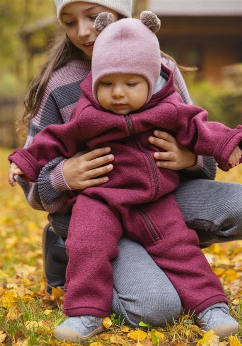 Infografic: Comparație materiale pantaloni copii (lână merinos, fleece, bumbac organic)